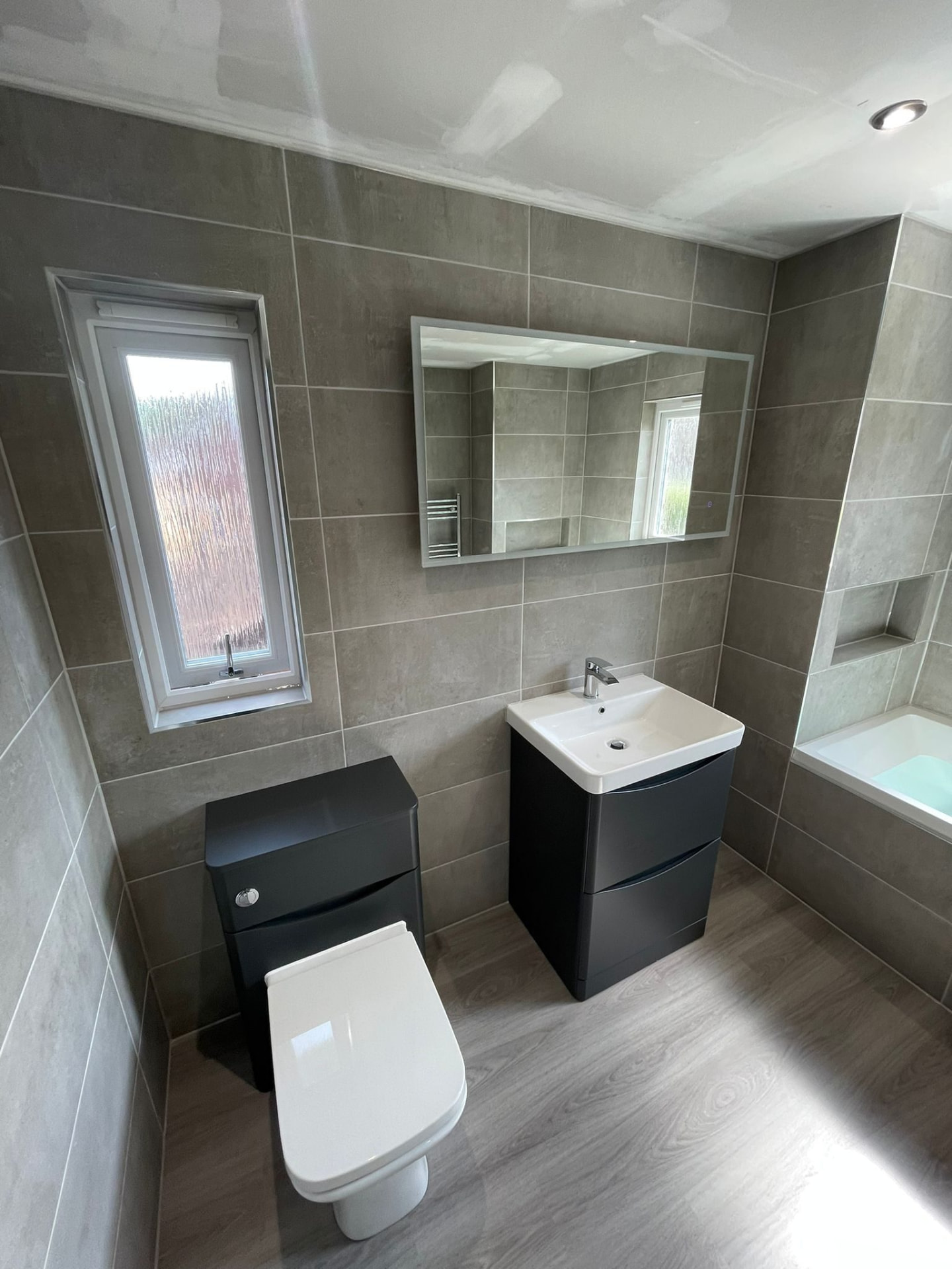 Fitted bathroom with concealed cistern WC and basin in Edinburgh