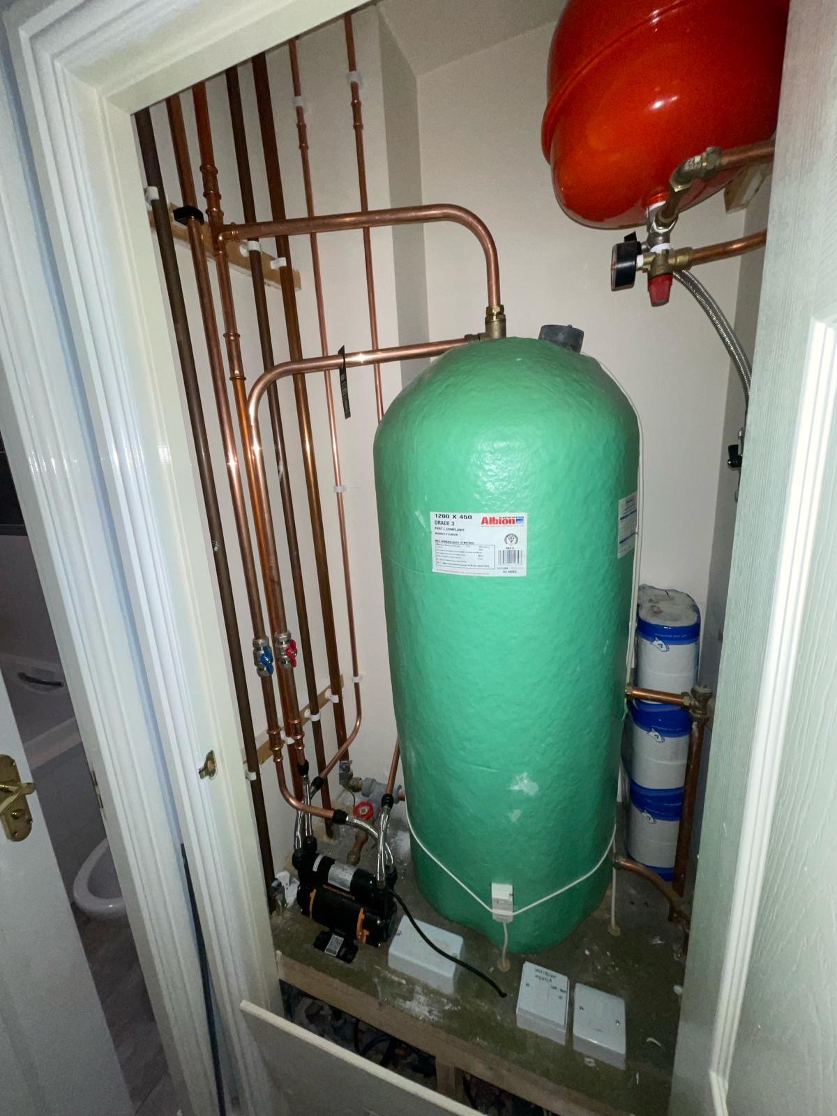 Hot water cylinder and heating system pipework installed in an Edinburgh home