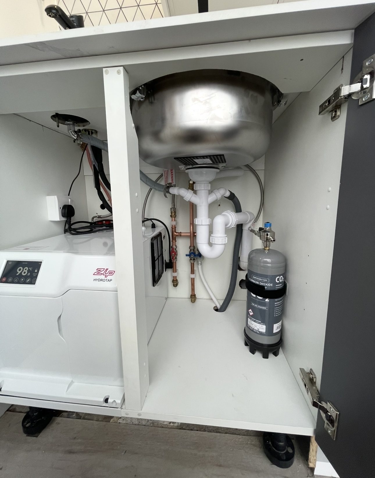 Undersink filtered boiling water tap installation with tidy copper supply pipework in Edinburgh